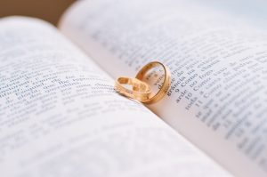 marriage vows - rings in an open book